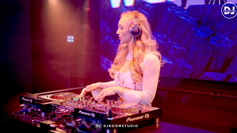 Wendie Vlaar with headphones behind the Pioneer set in front of the LED wall
